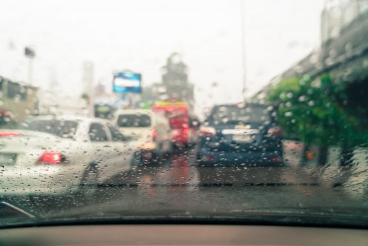 abstract blur rain drops on car glass - vintage effect filter